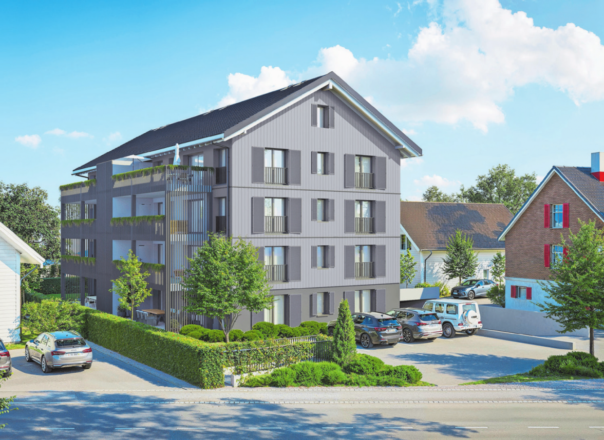 Das Gesamtbild des Mehrfamilienhauses fügt sich harmonisch in die umgebenden Gebäude ein.